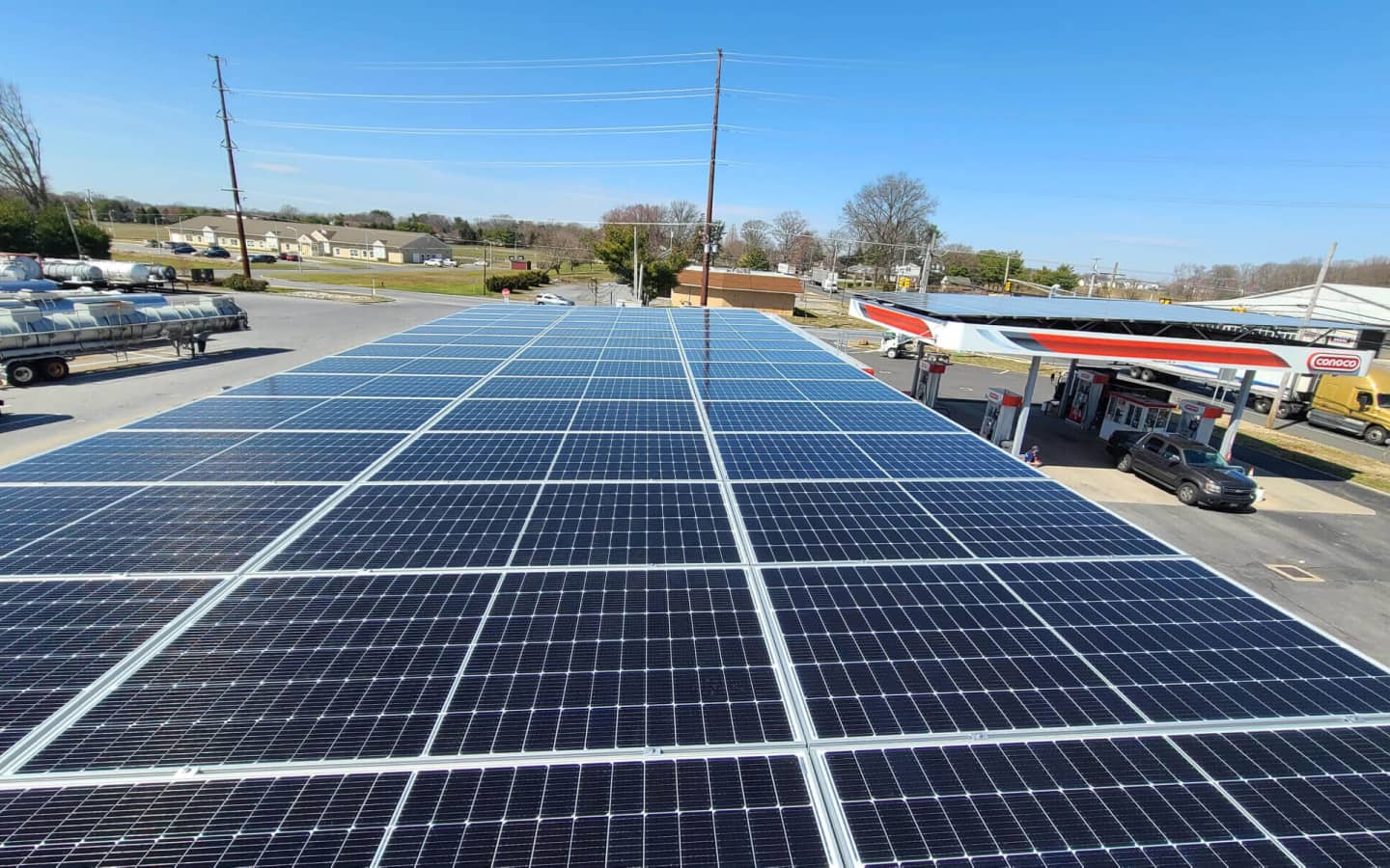 A bright and modern Conoco gas station with a sleek sign and a clean parking lot